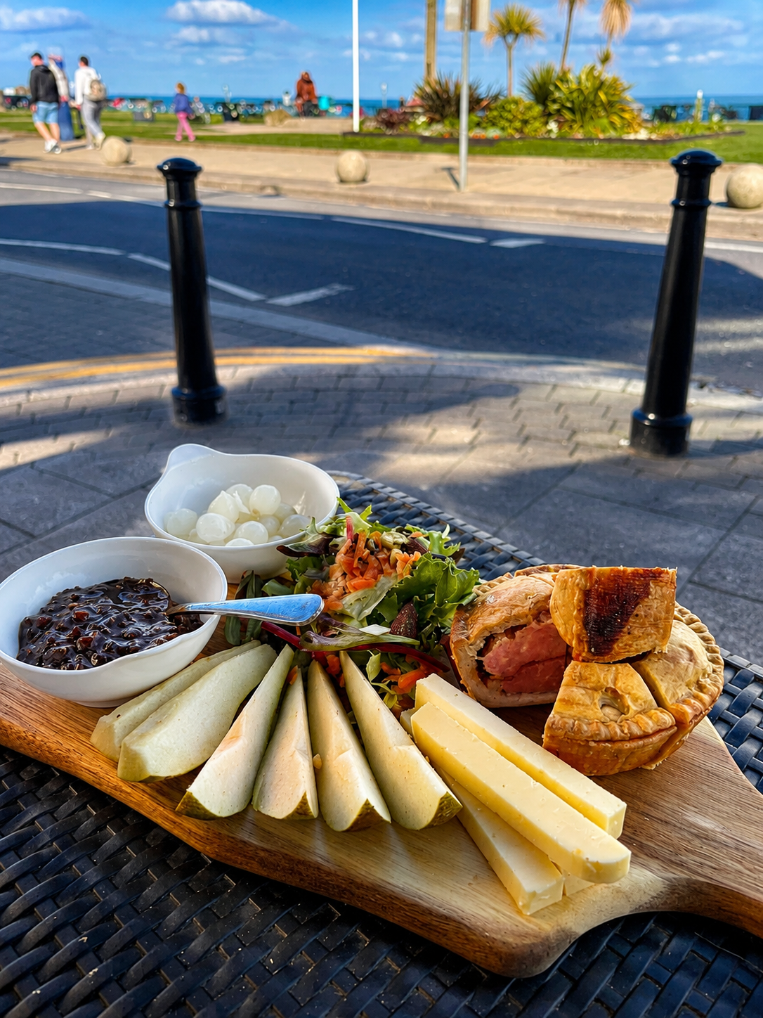 A sharing board with fruit, cheese and savoury pastries on the Seaham seafront